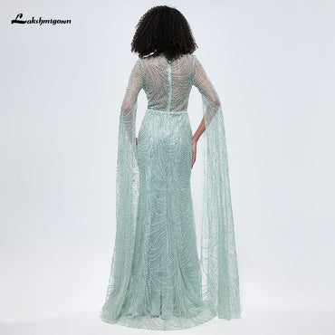 Abito da sera a sirena Dubai verde menta con maniche a mantella e perline con perline L9668
