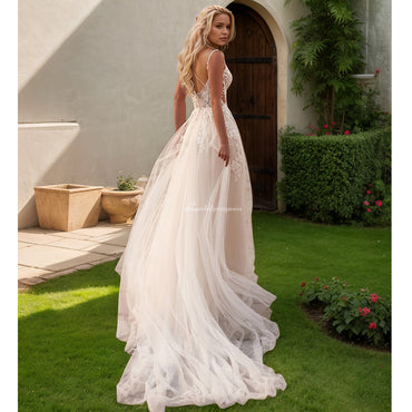 セクシーな花嫁のウェディングドレス スパゲッティ ストラップ V ネック アップリケ バックレス A ライン シャンパン ブライダル ドレス