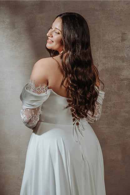 Vestido de novia de manga larga con encaje y hombros descubiertos